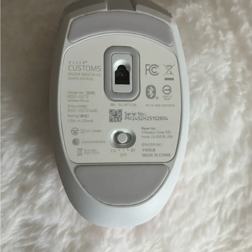 White Wireless Mouse with Pink Sensor Light